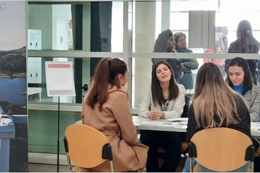 Company hr staff carrying out short interviews with students at university premises